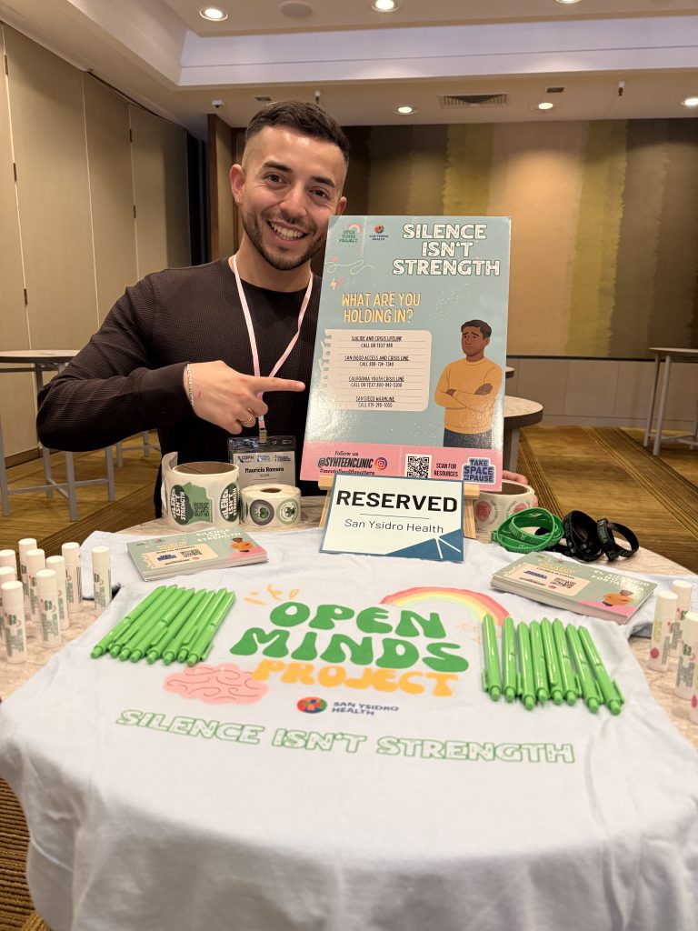 Mauricio promoting Silence Isn’t Strength at a local event. 